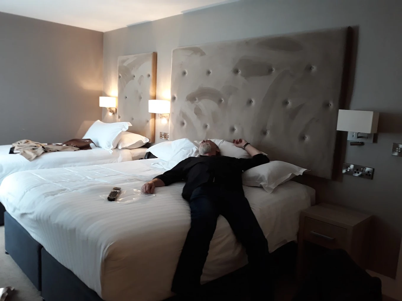 Guest laying across bed